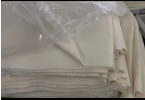 毛呢面料厂家出售羊绒面料，白色双面呢面料，欢迎服装厂的老板来电谈