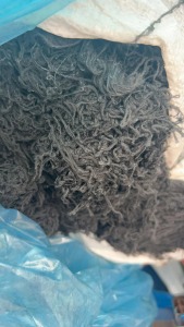 长期出售黑色的涤纶低弹丝，涤纶废丝，涤纶干丝