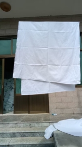 处理一批铁路白床单,涤棉材质的,宽90×210,重0.4公斤,九成新