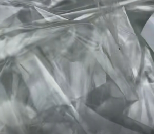 长期出售PET复合PP膜废料，一面带胶