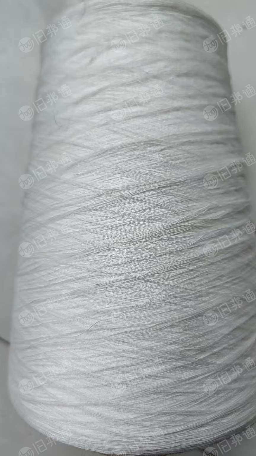 出售环锭纺厂环流21支包心纱90涤长丝，10粘胶，包心氨伦丝，10吨，货在江苏徐州
