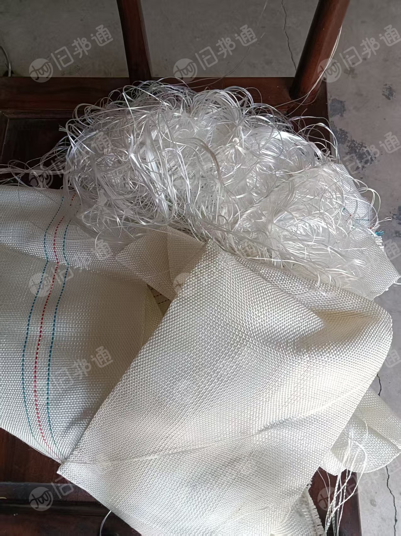 长期出售做消防水带下来的涤纶废丝,涤纶废布,现货七八吨