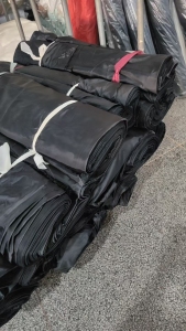 长期大量出售服装库存布，涤塔夫，舒美绸，色丁布，包装布，胚布