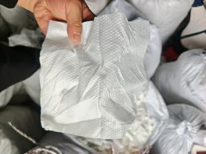 长期出售制品厂下来的涤纶配比水刺无纺布干巾湿巾下脚料，无纺布边角料，含水30左右，现货20吨