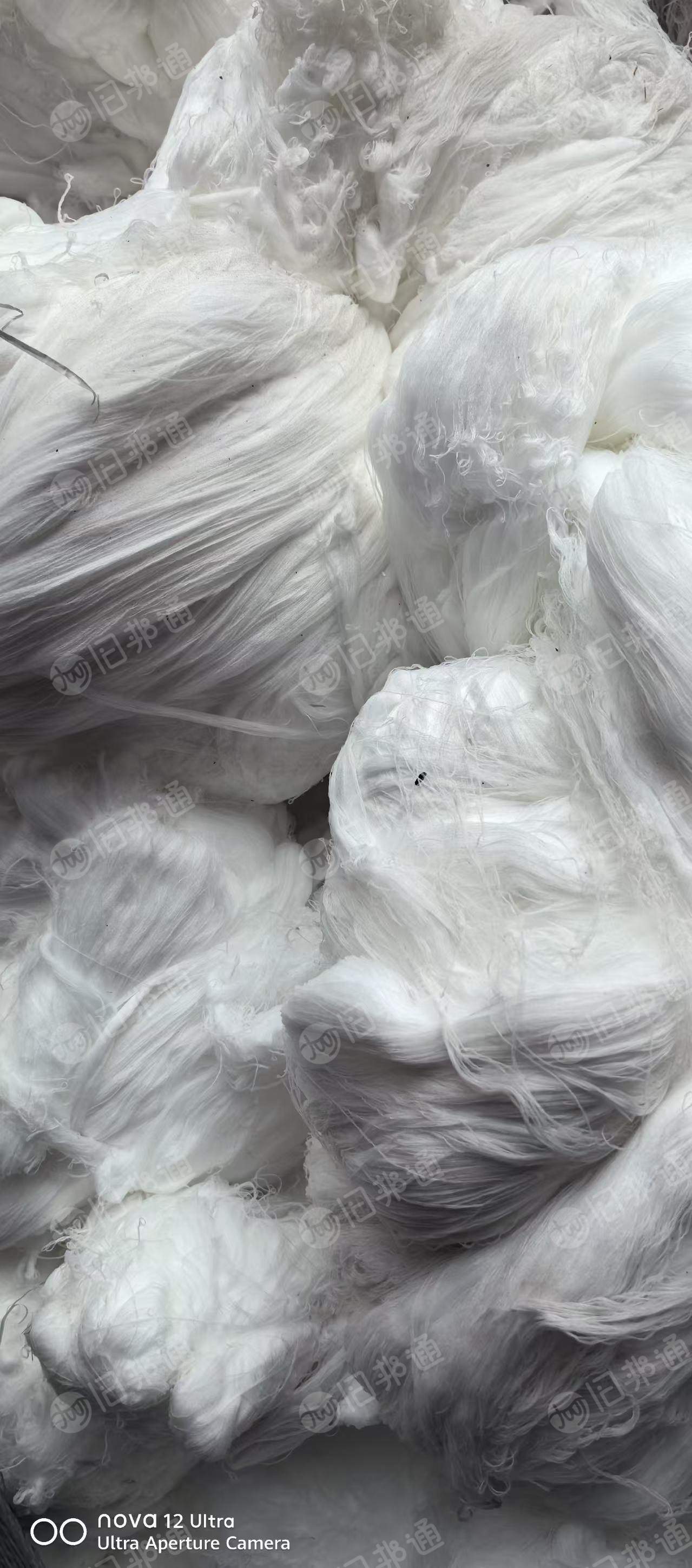 长期出售织风电布厂出来的白色涤纶弹丝，涤纶废丝，涤纶干丝，现货四五吨，货在重庆