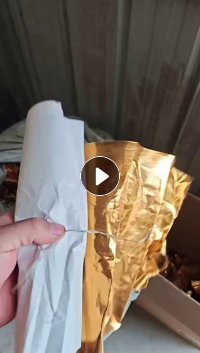 纸厂处理一批卷筒覆膜金纸,瑕疵品