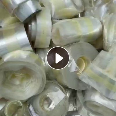 出售PET膜废料，中间带胶布，有宽有窄，可造粒或者做扫把丝