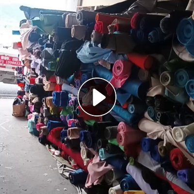 长期出售箱包布，箱包大小卷布，门幅1.5，带点轻桨，月供20吨，货在浙江绍兴