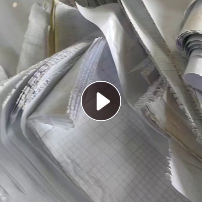 出售白色淋膜纸废料，卷筒划开的，吨袋装