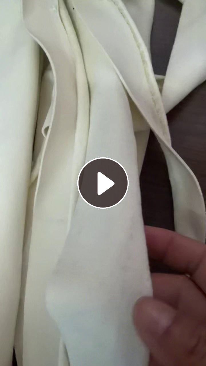 出售做裤子下来的米黄色化纤废布，拉丝布，现货10多吨，货在江西抚州