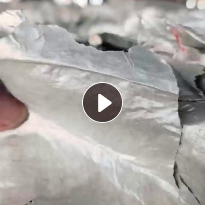 出售牛奶盒下来的铝塑膜和铝塑膜胶带，含铝25左右，现货60多吨